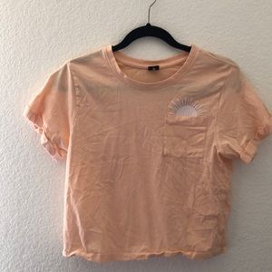 Coral graphic cropped t-shirt.